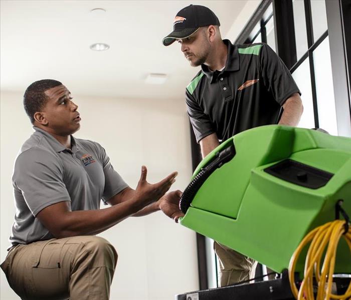 Image of SERVPRO employees working together